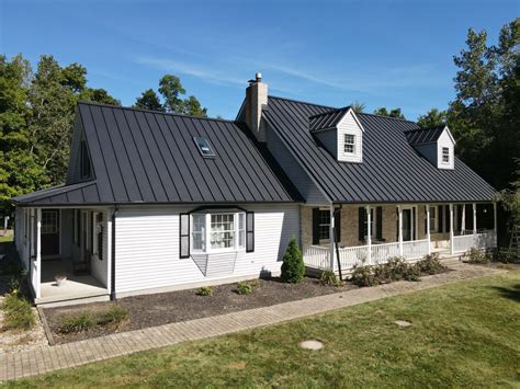 brick house with metal roof photos|white house black metal roof.